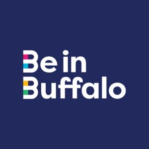 Be in Buffalo wordmark logo, blue background and white text with accent colors of pink, light blue, yellow and green